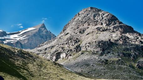 Majestic Mountain Landscape Under Clear Blue Skies wallpaper
