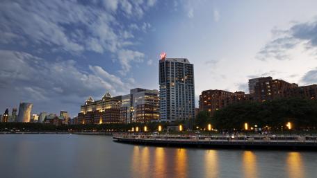 City Skyline at Dusk Over Water wallpaper