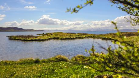 Serene Lake Horizon Under Bright Blue Sky wallpaper