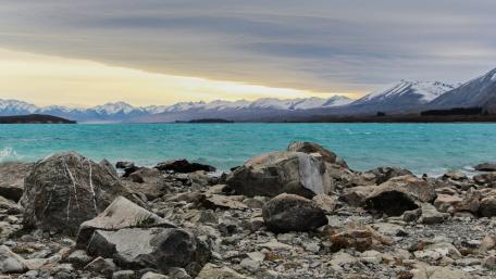 Tranquil Waters Amidst Majestic Mountains wallpaper
