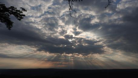 Dramatic Sunlight Breaking Through Clouds wallpaper