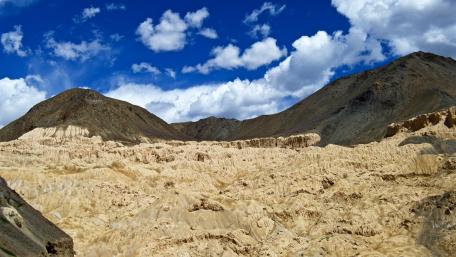 Majestic Desert Landscape Under Blue Sky wallpaper