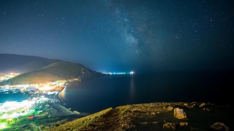 Starlit Cityscape by the Sea wallpaper