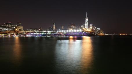 Vibrant Night Cityscape by the Water wallpaper