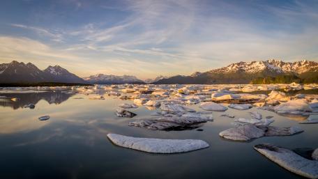 Serene Glacial Landscape Reflecting Mountains and Sky wallpaper