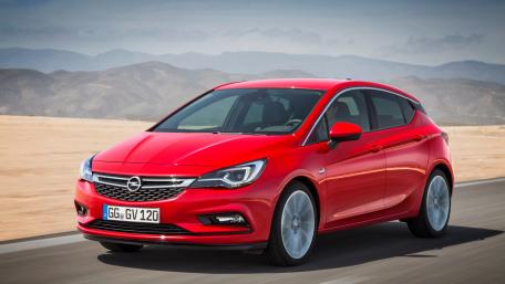 Sleek Red Car on Open Road wallpaper