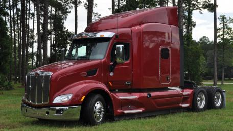Red Truck in Scenic Forest Setting wallpaper