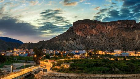 Stunning Twilight Cityscape Overlooking Mountains wallpaper