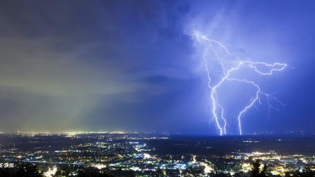 City Lights and Electrifying Thunderstorm wallpaper