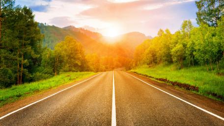 Majestic Mountain Road at Sunrise wallpaper