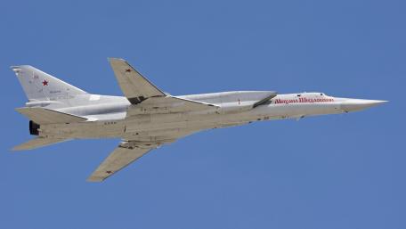 Soviet Bomber in Flight Above Blue Sky wallpaper