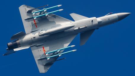 High-Altitude Fighter Jet in Action wallpaper