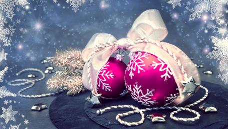 Festive Pink Christmas Ornaments Displaying Holiday Cheer wallpaper