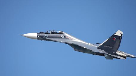 Sleek Military Jet in Action Displaying Power and Speed wallpaper