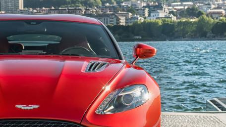 Vibrant Red Sports Car by the Water wallpaper