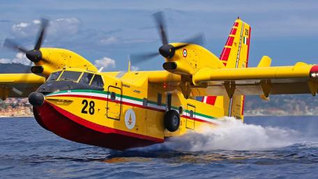 Vibrant Yellow Water Bomber in Action wallpaper