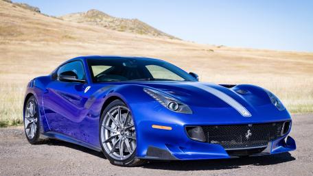 Sleek Blue Sports Car Wallpaper wallpaper