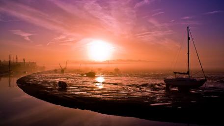 Misty Sunrise Over Serene Sea Landscape wallpaper