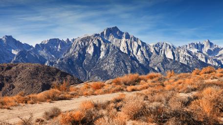 Majestic Mountain Landscape Under Clear Blue Sky wallpaper
