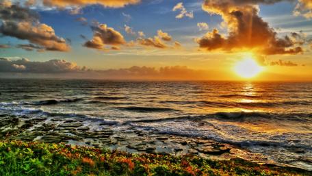 Serene Sunset Over the Ocean Coastline wallpaper
