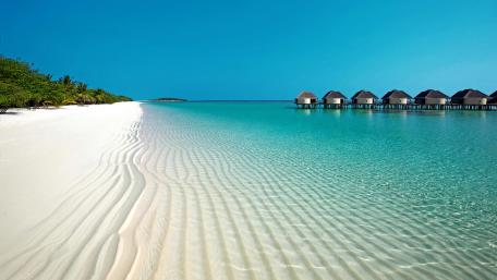 Overwater Bungalows On The Beautiful Seashore wallpaper