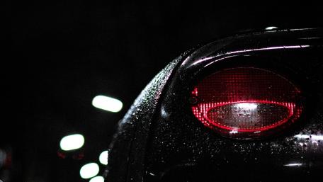 Glistening Red Headlamp in the Night wallpaper