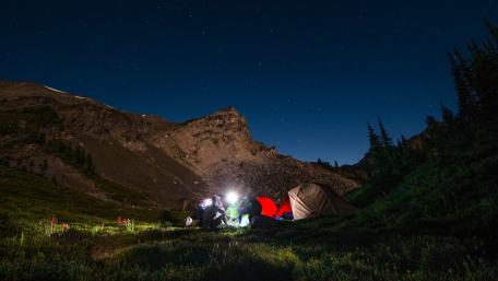 Camping Under a Starry Sky in the Wilderness wallpaper