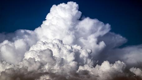 Majestic Cumulus Clouds Above Deep Blue Sky wallpaper