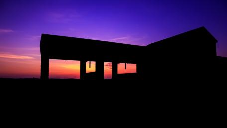 Twilight Cottage Under a Pink Sky wallpaper