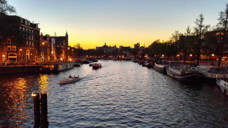 Serene Canal Sunset in a Charming Cityscape wallpaper
