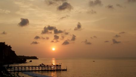Serene Sunset Over the Pier in Dusk Glow wallpaper