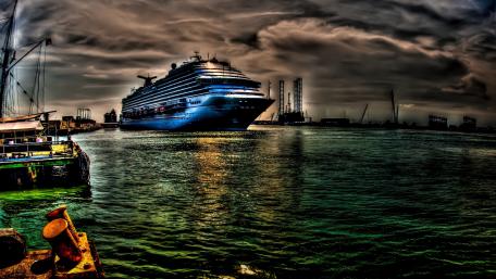 Majestic Cruise Ship Under Cloudy Skies wallpaper