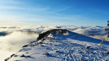 Majestic Winter Horizon Above the Clouds wallpaper
