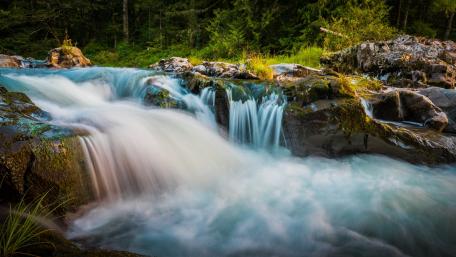 Serene Beauty of Flowing Waterfalls wallpaper