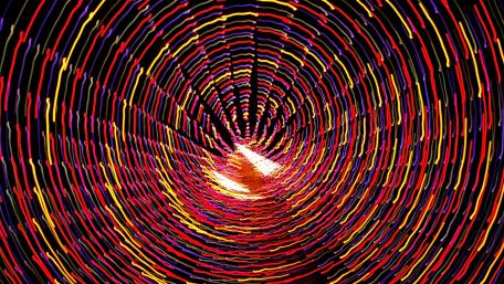 Vibrant Spiral of Light and Colorful Motion wallpaper