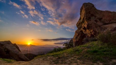 Majestic Sunset Over Rocky Landscape wallpaper