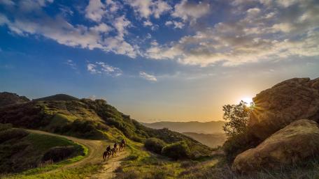 Golden Hour Horse Riding Adventure in Nature wallpaper