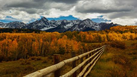 Scenic Autumn Mountain Landscape With Wooden Fence wallpaper