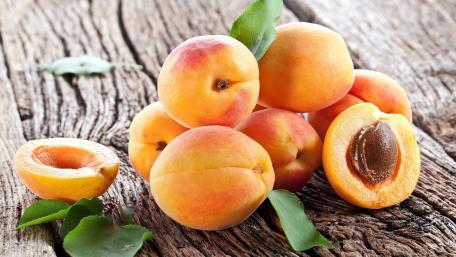 Fresh Apricots on Rustic Wood Background wallpaper