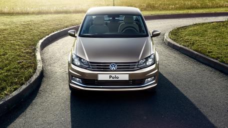 Sleek Volkswagen Polo Elegance on a Scenic Road wallpaper