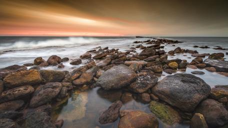 Tranquil Waters and Rocky Shores wallpaper