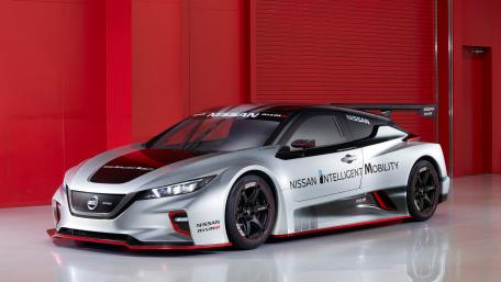 Sleek Nissan LEAF Concept on Showroom Floor wallpaper