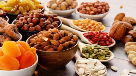 Colorful Assortment of Nuts and Dried Fruits for Healthy Snacking wallpaper