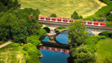 Tranquil Train Journey Over Waterway wallpaper