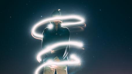 Guy on neon circles wallpaper