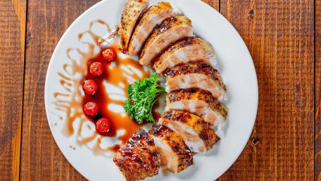 Deliciously Grilled Pork with Cherry Tomatoes and Sauce wallpaper