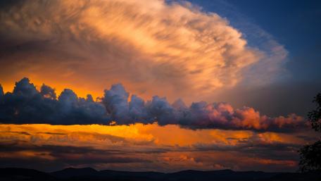 Majestic Cumulus Clouds Above the Horizon wallpaper