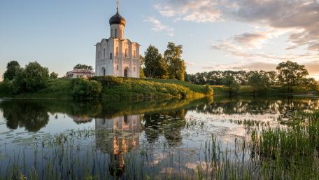 Serene Temple Reflection by the Water wallpaper