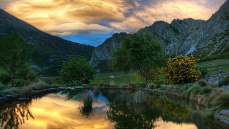 Golden Reflections in a Serene Mountain Valley wallpaper