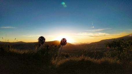 Golden Sunrise Over Serene Mountainscape wallpaper